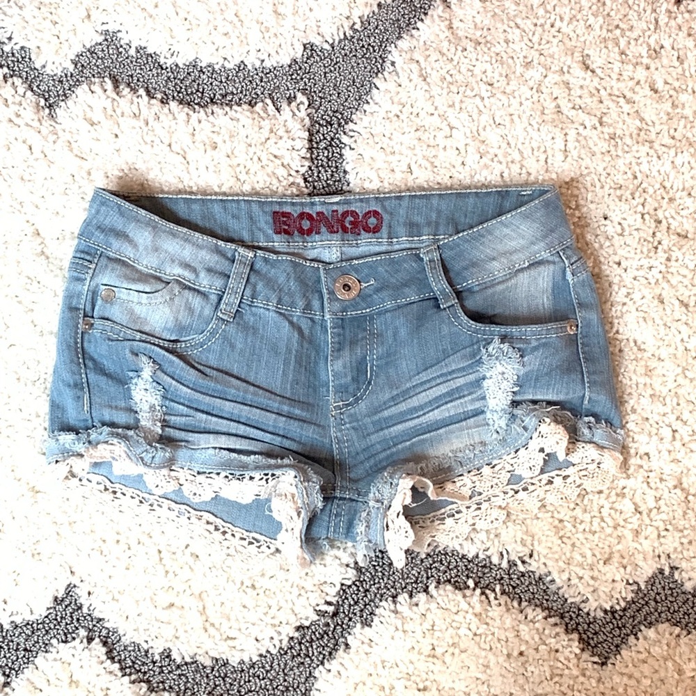 Light blue shorts. White ruffles at bottom.